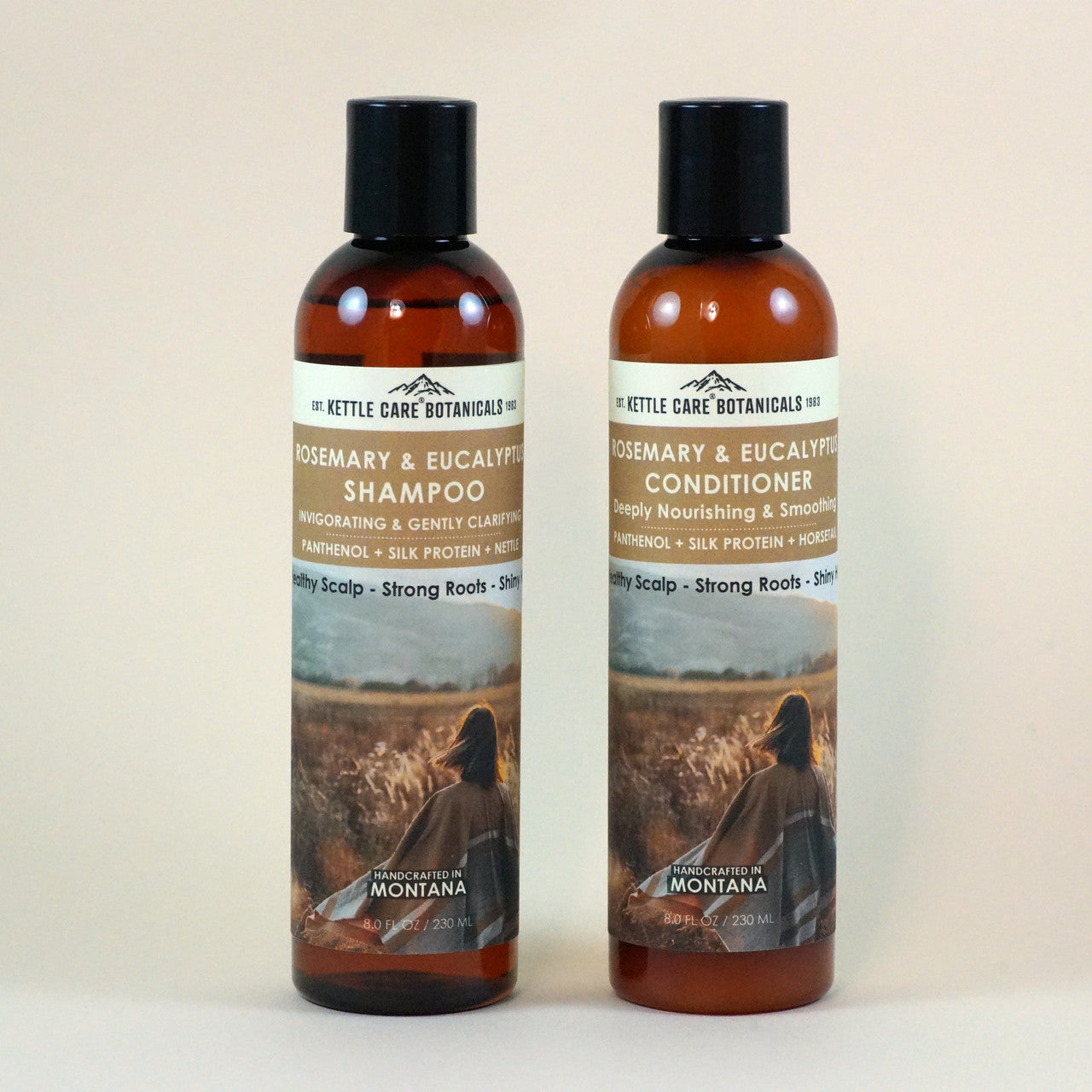 Two Amber Brown 8oz bottles against a neutral background. One Rosemary & Eucalyptus Shampoo w/ Nettle and one Rosemary & Eucalyptus Conditioner. Try them today!