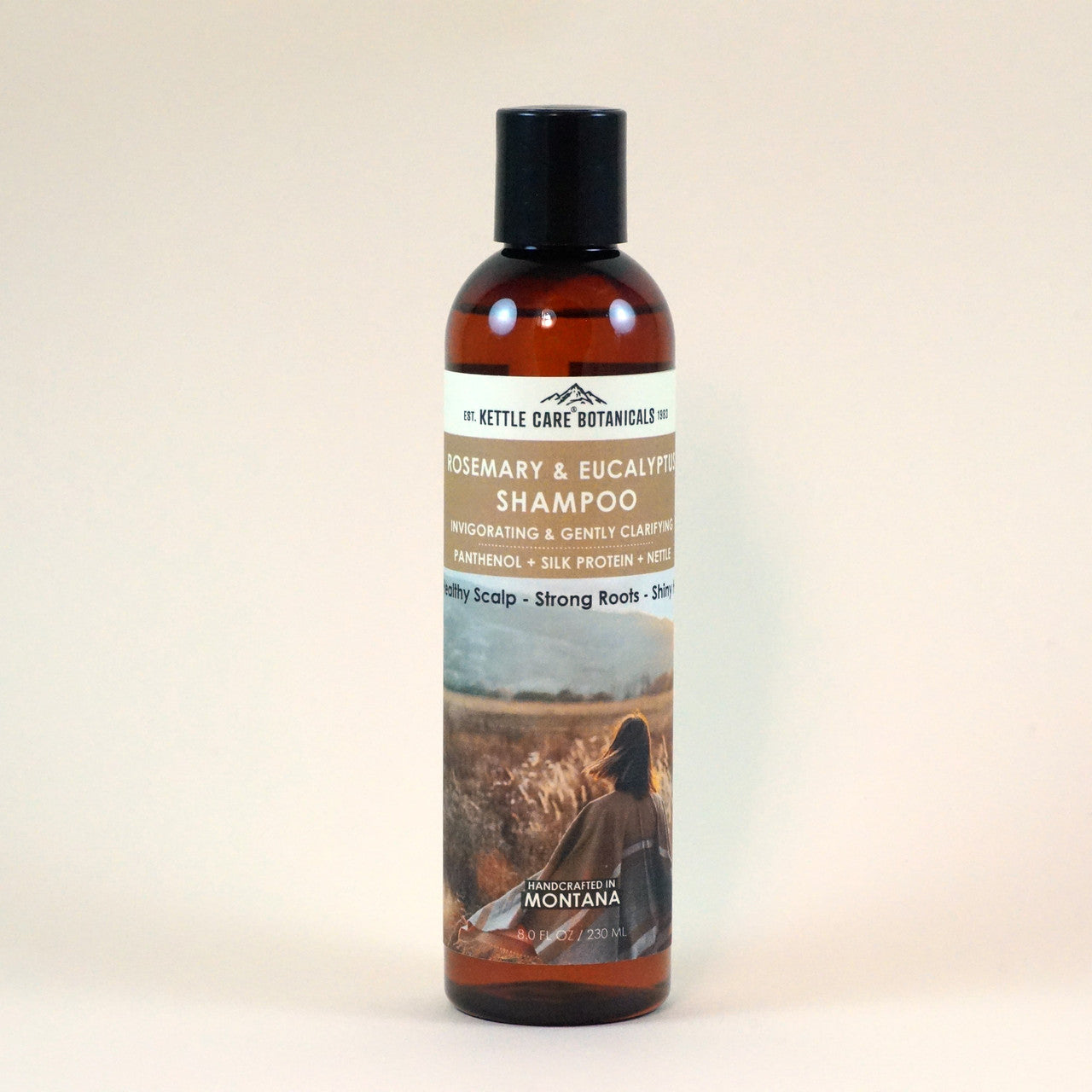 This is a photo of a bottle of our Nettle Shampoo. Enriched with Rosemary & Eucalyptus. Infused with Panthenol & Silk Proteins to improve hairs' strength and add shine.